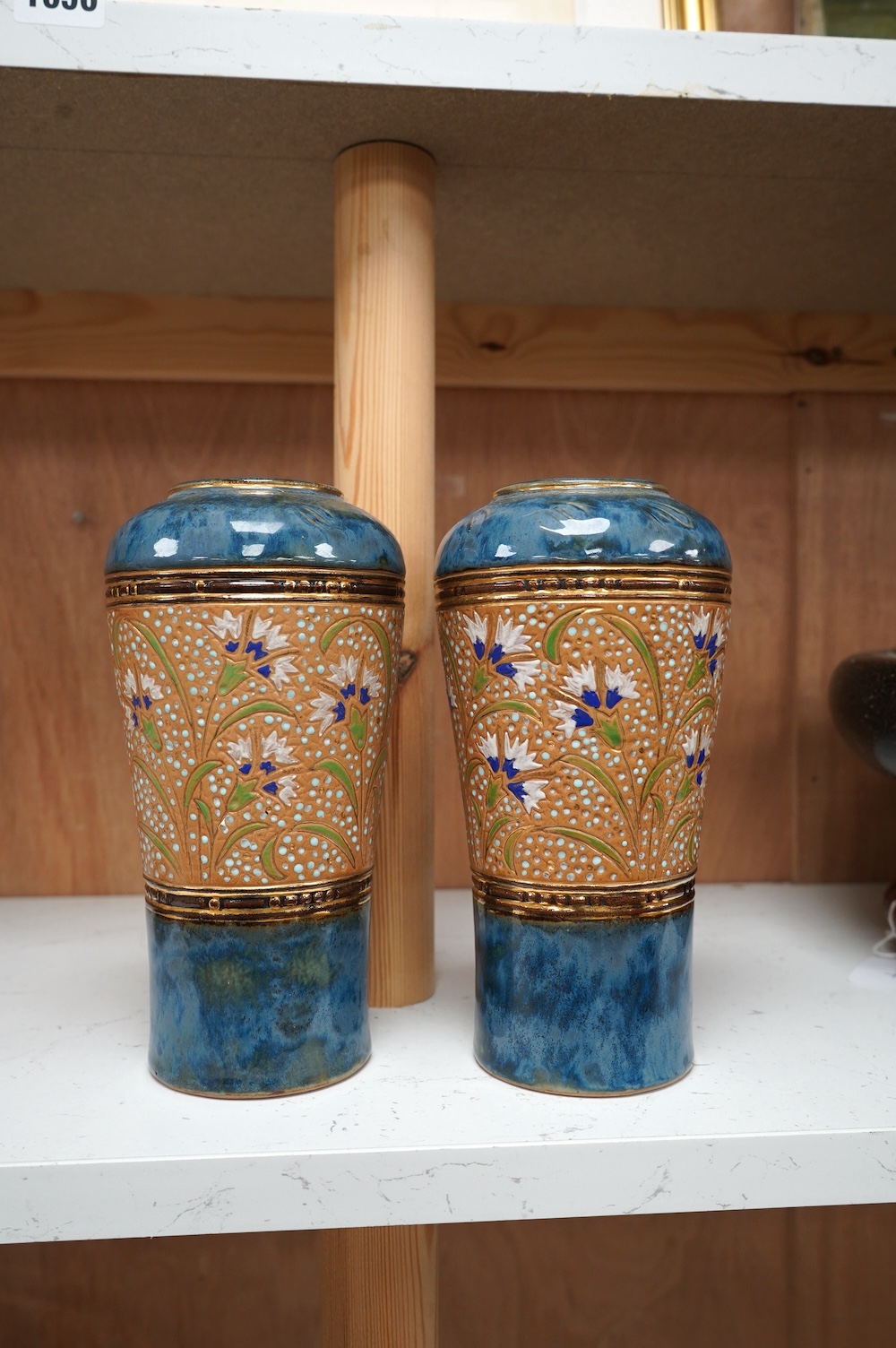 A pair of Royal Doulton Lambeth stoneware vases, 20cm high. Condition - good